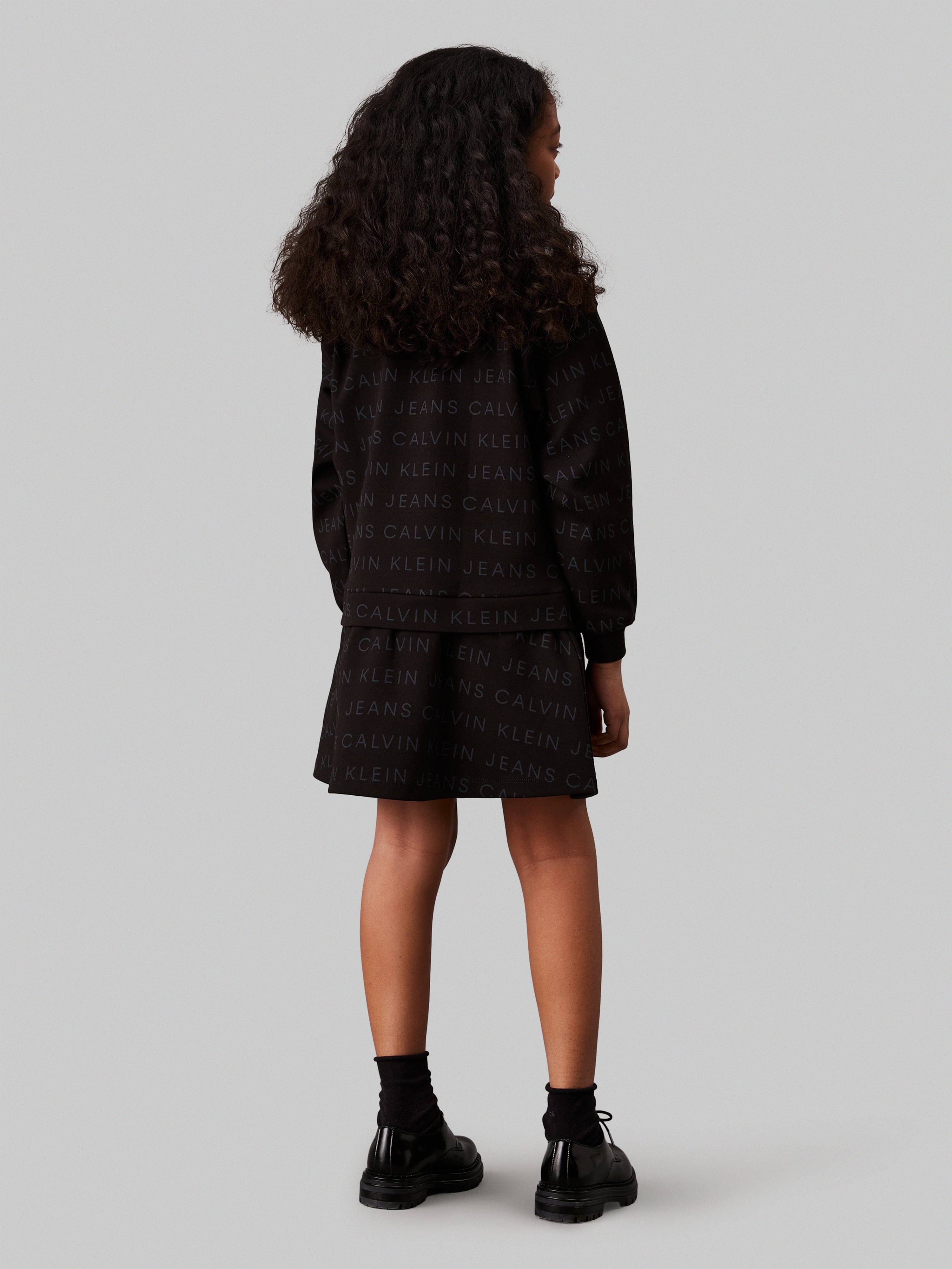 Calvin Klein Girls Logo AOP Fleece Dress in Black