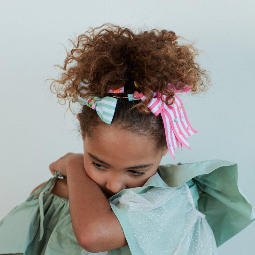 Barrette nœud rayée rose