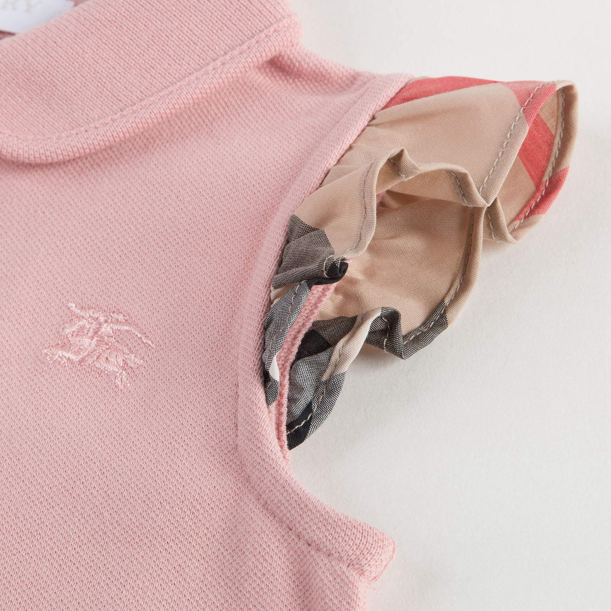 Polo rose clair avec volants à carreaux pour bébés filles