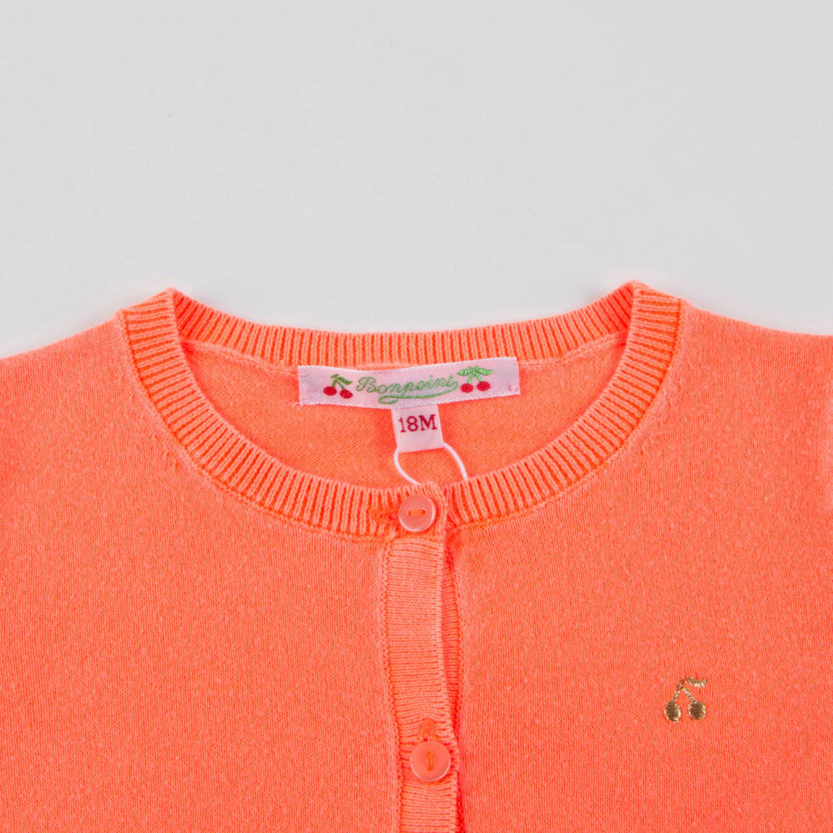 Cardigan en maille orange pour bébé fille