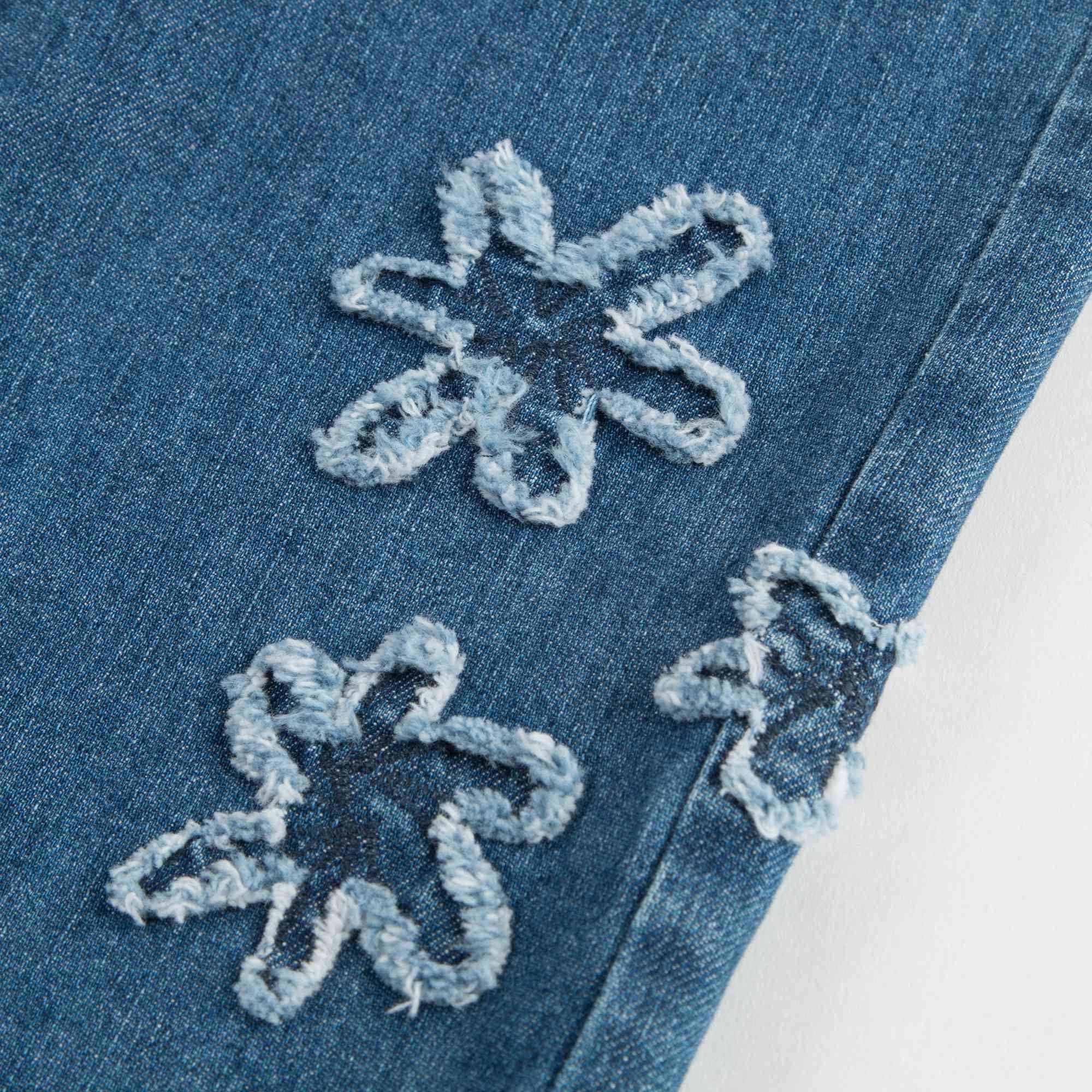Girls Denim Blue Cotton Jeans With Flowers Trims